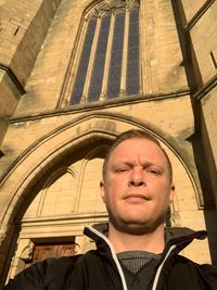 Low angle portrait of man outdoors