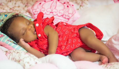 Cute baby sleeping on bed