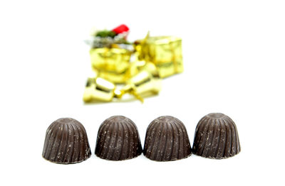 Close-up of candies against white background