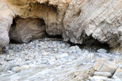 Close-up of rock formation in water