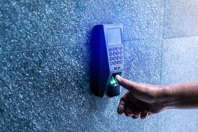 Cropped hand of person holding water