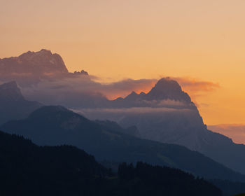 Scenic view of mountains against sky during sunset