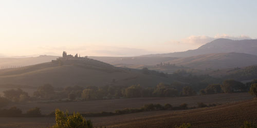 Scenic view of landscape against sky during sunset