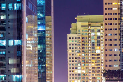 Illuminated buildings in city at night