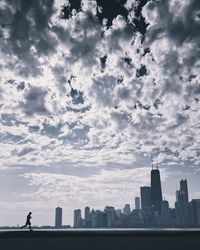View of city against cloudy sky