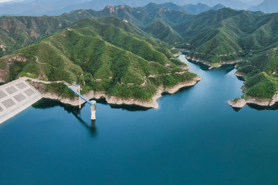 High angle view of lake amidst mountains