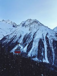 Scenic view of snowcapped mountains against clear sky