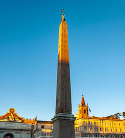 Low angle view of historical building against blue sky