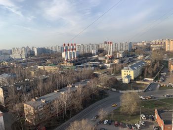 High angle view of street and buildings against sky