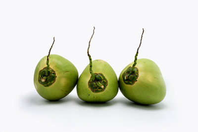 Close-up of fruits against white background