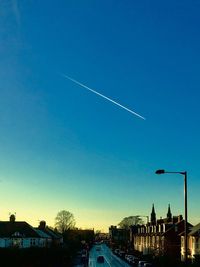 Low angle view of vapor trails in sky