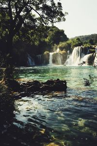 Scenic view of river flowing through rocks