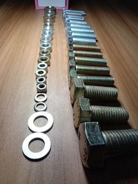 High angle view of piano keys on wooden table