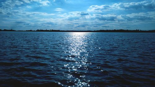 Scenic view of sea against cloudy sky