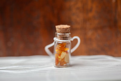 Close-up of glass of jar on table