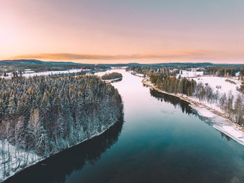 Scenic view of lake against sky during sunset