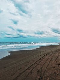 Scenic view of beach against sky