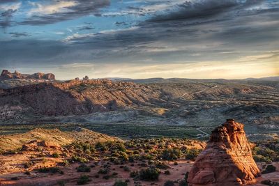 Scenic view of landscape against cloudy sky