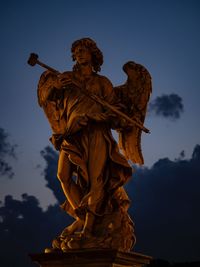 Low angle view of statue against sky