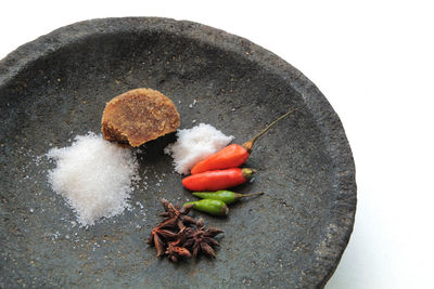 High angle view of chili peppers on white background