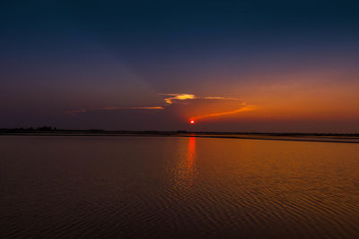 Scenic view of sea against romantic sky at sunset