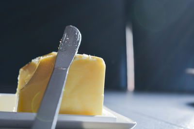 Close-up of table knife on cheese