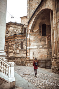 Woman standing outside temple