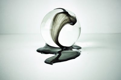 Close-up of light bulb on table