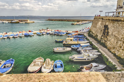 Boats moored at harbor