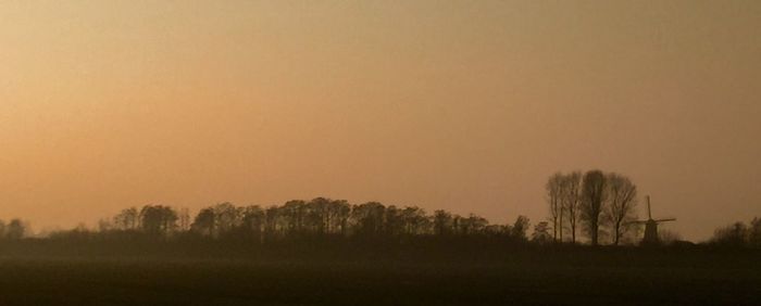 Scenic view of landscape against sky during sunset