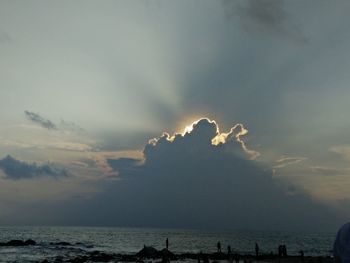 Scenic view of sea against cloudy sky