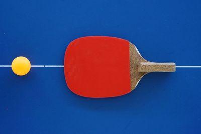 High angle view of table tennis bat and ball