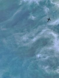 Low angle view of airplane in sky