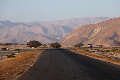 Road in desert against clear sky