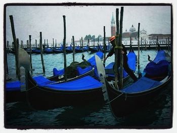 Boats moored at harbor