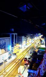 Train in illuminated city at night