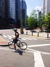 People riding bicycle on road