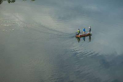 High angle view of people on boat in sea