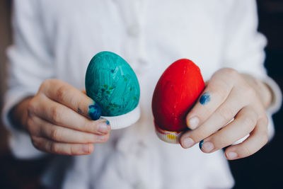 Close-up of human hand holding multi colored candies