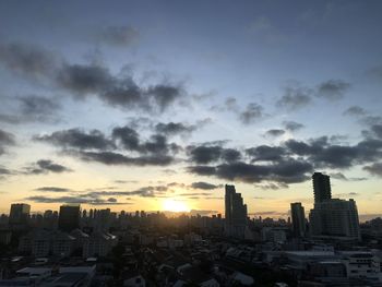 Cityscape against sky during sunset