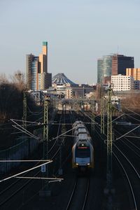 High angle view of railroad tracks amidst buildings in city