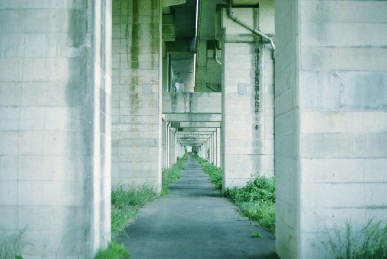 architecture, built structure, building exterior, the way forward, building, diminishing perspective, corridor, window, narrow, door, day, city, empty, walkway, wall - building feature, indoors, footpath, wall, no people