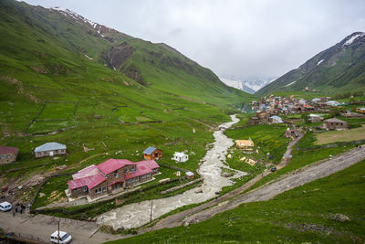 Scenic view of landscape and mountains against sky