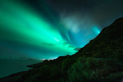 Low angle view of mountain against sky at night