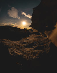 Scenic view of silhouette mountains against sky during sunset