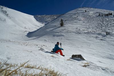 Man skiing on snowcapped mountain