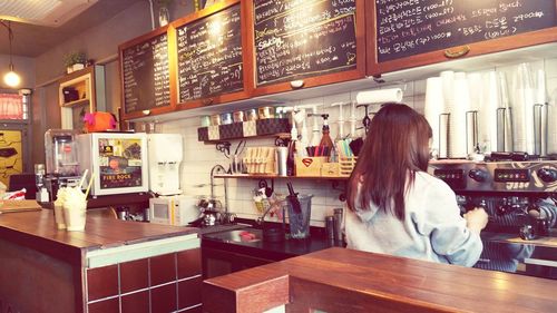 Woman sitting in restaurant