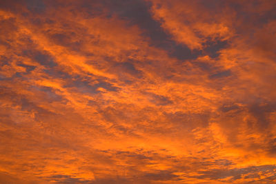 Low angle view of dramatic sky during sunset