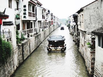 View of canal along buildings