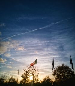 Silhouette of flags at sunset